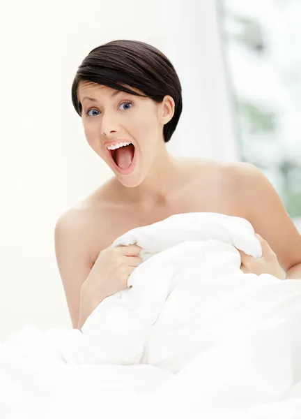 Halfnaked woman hugs the quilt — Stock Photo, Image