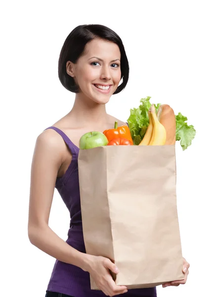 Menina bonita com o pacote de frutas e legumes — Fotografia de Stock