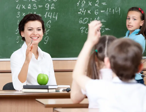 Teacher questions pupils at algebra — Stock Photo, Image