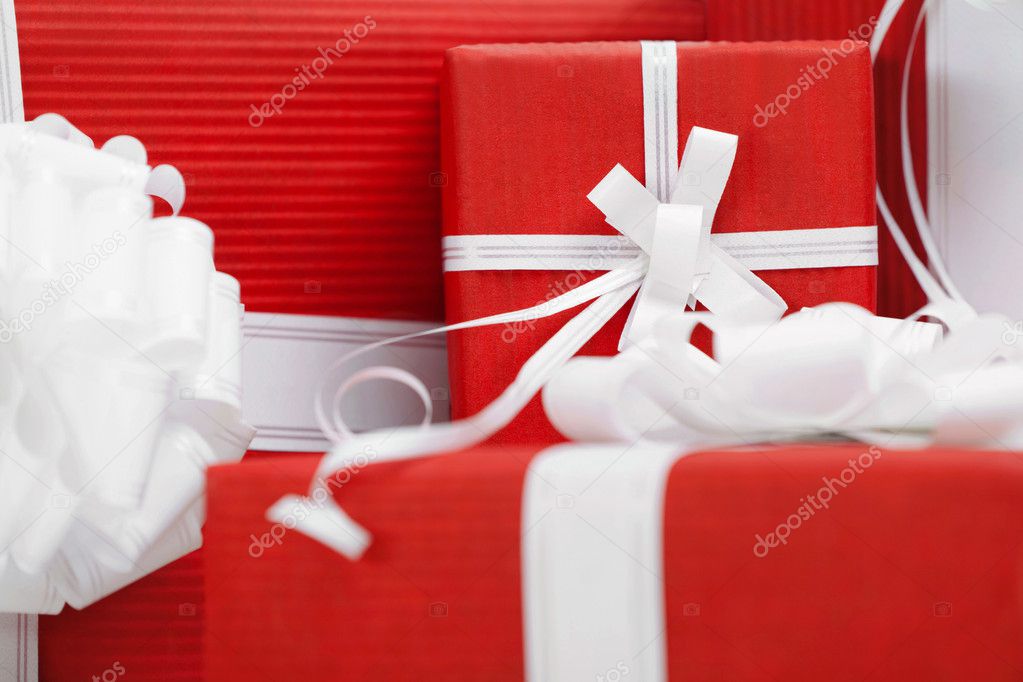 Presents with red packaging and white bows