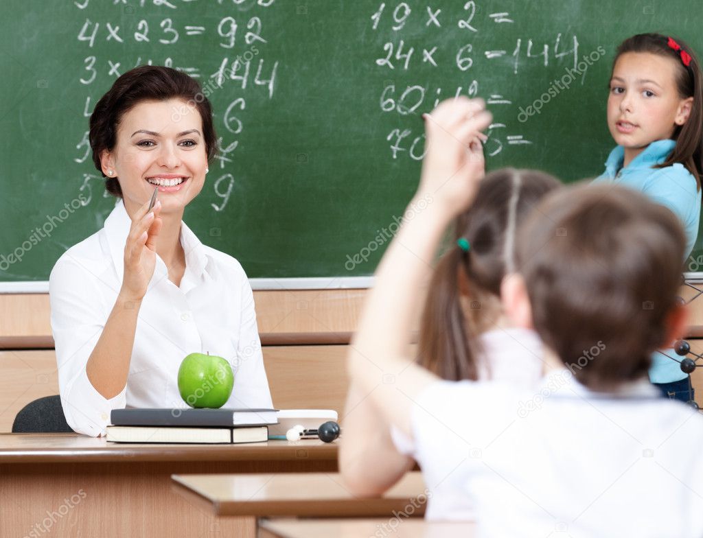 Teacher questions pupils at algebra