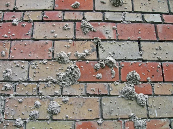 Αφαιρετικά σημεία άμμο σε τοίχο από τούβλα, βιομηχανία λεπτομέρειες. — Φωτογραφία Αρχείου
