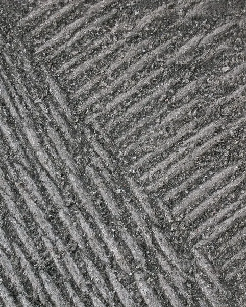 Abstrakt skadad svart asfalt, vintage textur närbild. — Stockfoto