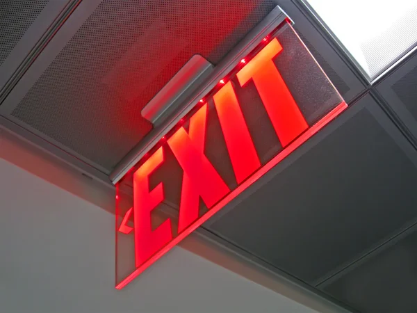 Exit sign inside of silver surface, security details. — Stock Photo, Image