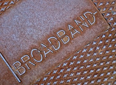 Cable broadband as text on metal surface, telecommunications. clipart