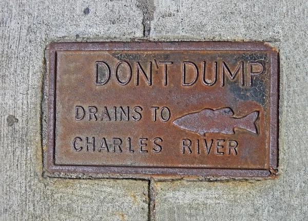 Do not dump drains to chales river as text on vintage surface. — Stock Photo, Image