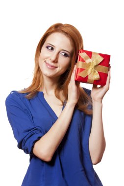 Beautiful red-haired girl with present box.