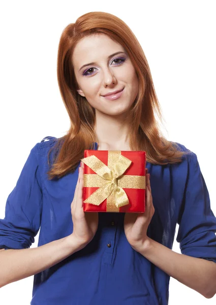 Beautiful red-haired girl with present box. — Stockfoto