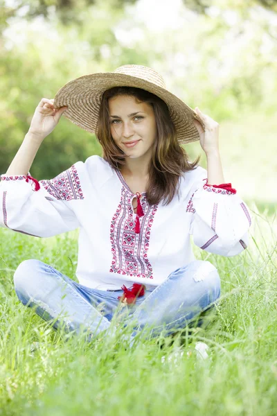 Slav teen girl at green meadow in national ukrainian clothing. — Stock Photo, Image