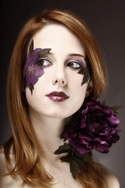 Style girl with makeup and violet flower. — Stock Photo, Image
