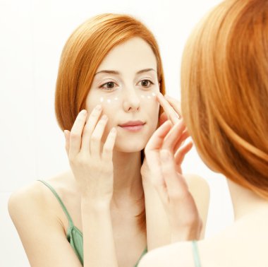 Surprised young woman in bathroom clipart