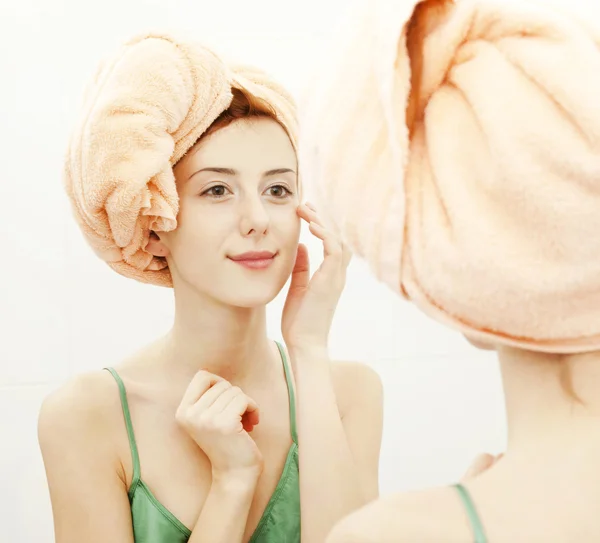 Surprised young woman in bathroom — Stock Photo, Image