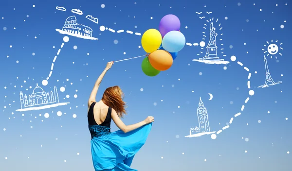 Girl with colour balloons at blue sky background dreaming abut n — Stock Fotó