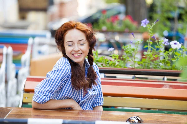 Funny hipster girl on the bench at the street — Stock Photo, Image
