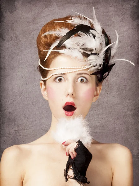 Surprised redhead girl with Rococo hair style at vintage backgro — Stock Photo, Image