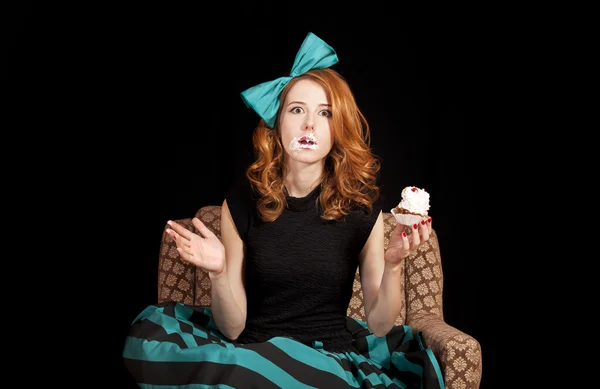 Redhead girl eating cake — Stock Photo, Image