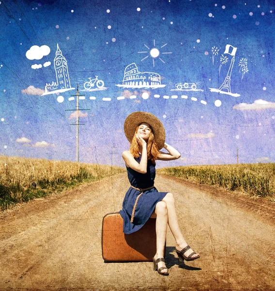 Lonely girl with suitcase at country road. — Stock Photo, Image