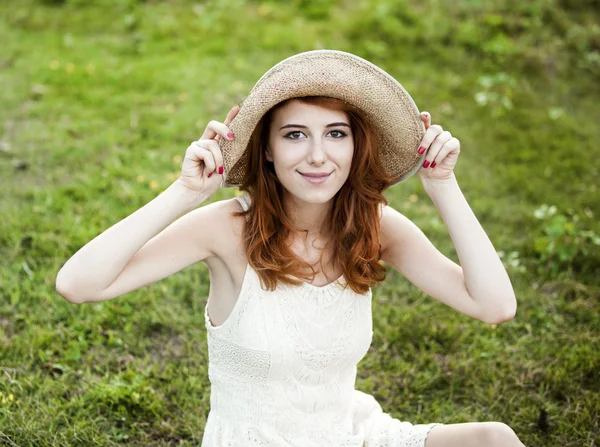 Redhead girl at green grass at village outdoor. — Stock Photo, Image