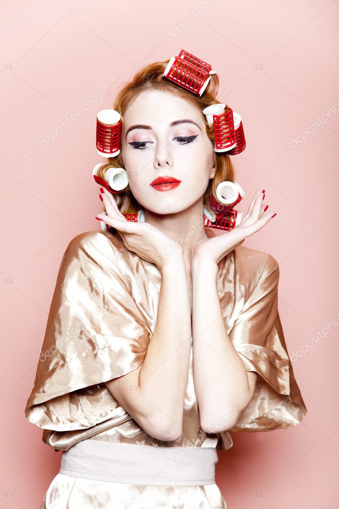 Redhead girl with curlers