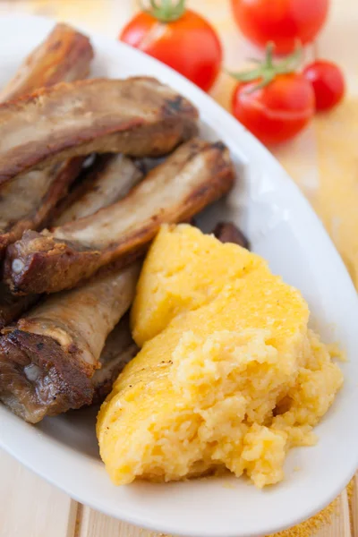 Pork chops en polenta — Stockfoto