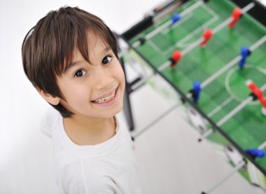 Children playing board soccer clipart