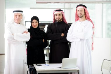 Successful and happy business arabic standing for a meeting clipart