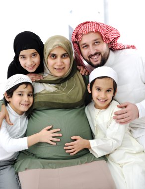 Pregnant Arabic Muslim woman with her family, husband and children clipart