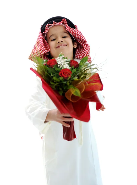 Arabic Muslim kid with bouquet of flowers — Stock Photo, Image