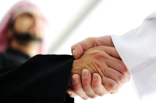 Closeup of business shaking hands over a deal — Stock Photo, Image