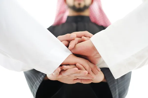 Equipo empresarial árabe mostrando unidad con sus manos juntas — Foto de Stock