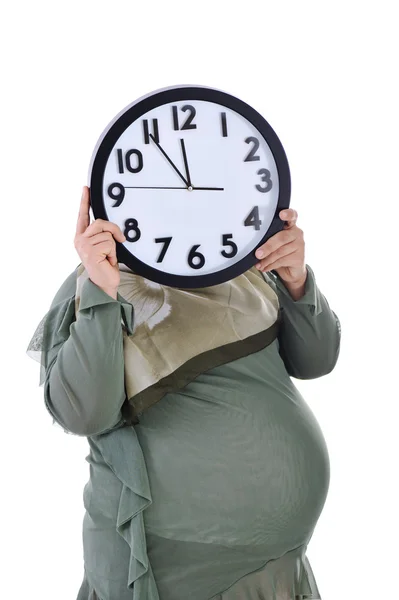 Пухлина вагітної мусульманки з годинником — стокове фото