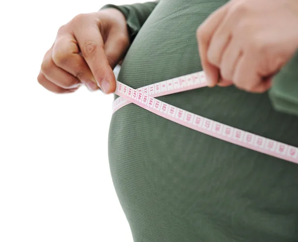Těhotná žena měření její břicho — Stock fotografie