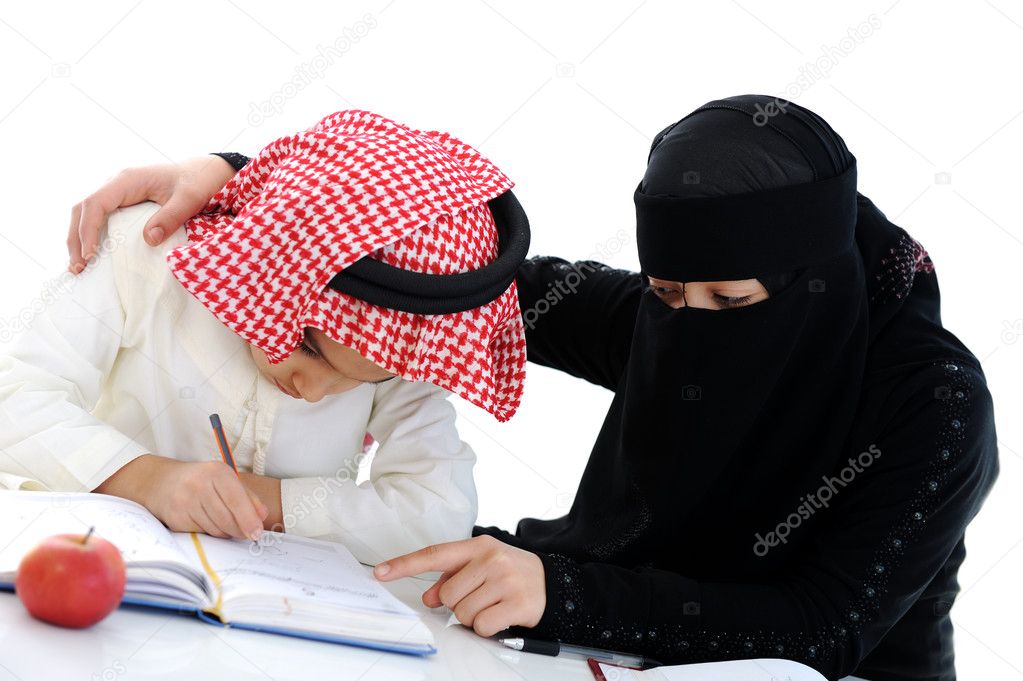 Muslim Arabic boy and girl doing homework