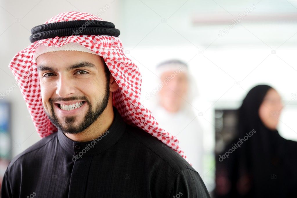 Happy Saudi man at work