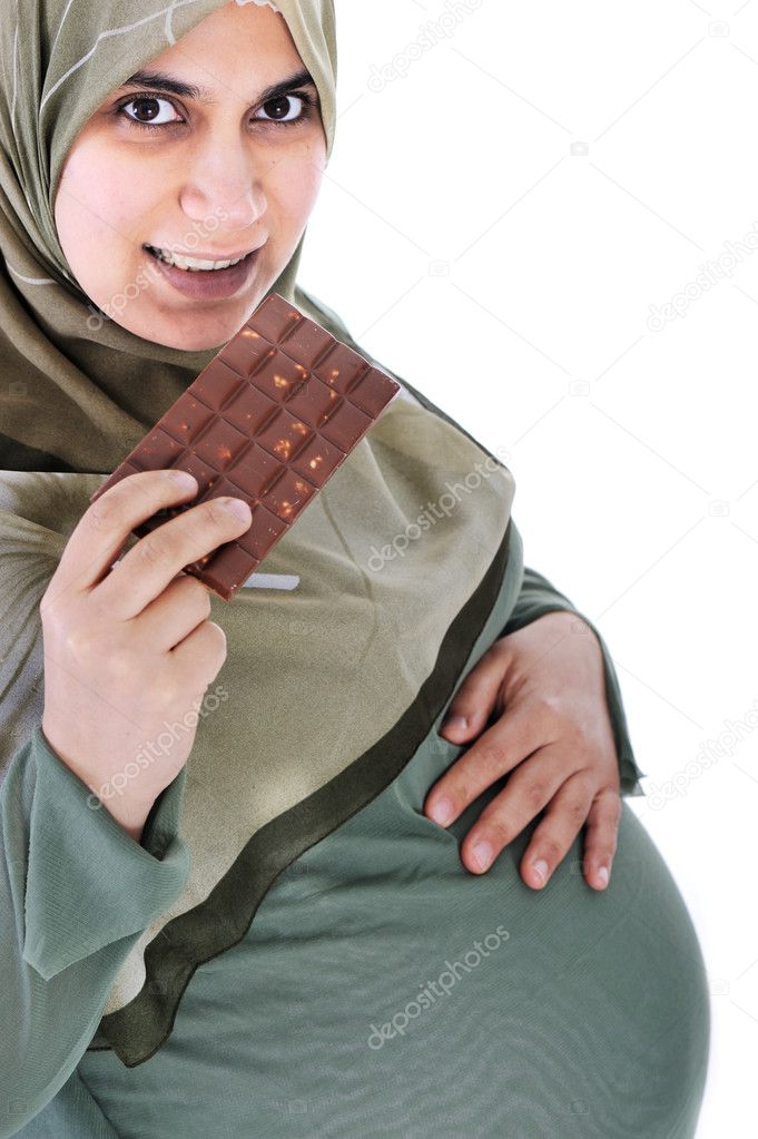 Pregnant muslim woman with chocolate