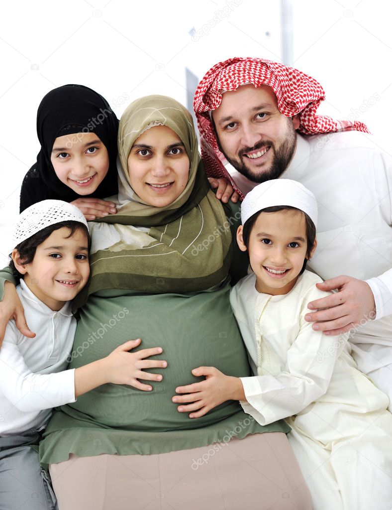 Pregnant Arabic Muslim woman with her family, husband and children