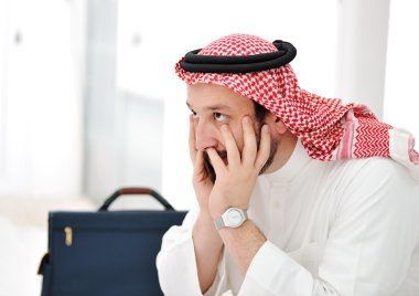 Worried arabic businessman clipart