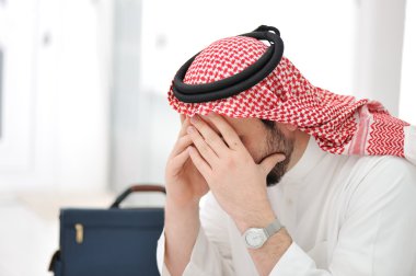 Sad middle eastern business man clipart