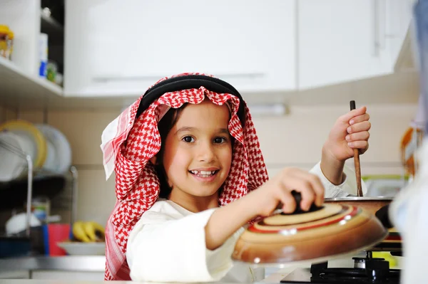 Little kid boy is cooking — Stock Photo, Image
