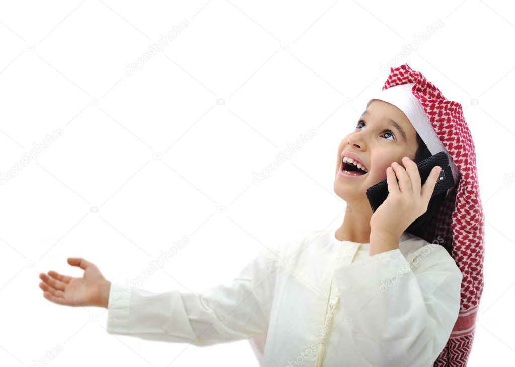 Arabic kid playing on phone in Ramadan