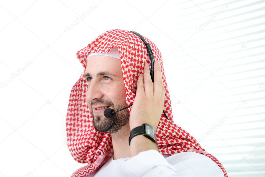 Portrait of a smart arabic business man using headset. Call center. Customer support. Helpdesk.