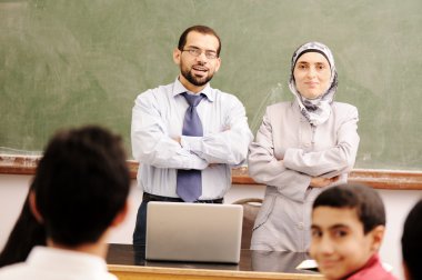 Arabic kids in the school, classroom wit a teacher clipart