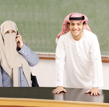 Smiling young success man, arabic traditional clothes, education clipart