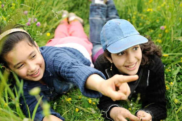 Cute arabic little girls smiling in a park — Stock Photo, Image
