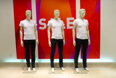 Window with dressed man mannequins clipart