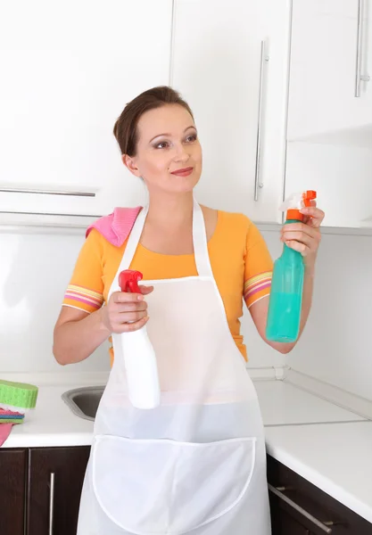 Woman cleaning kitchen Stock Photo