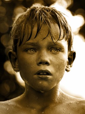 Vintage portrait of a child with water drop on face clipart