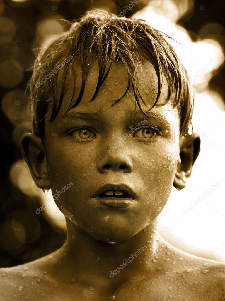 Vintage portrait of a child with water drop on face