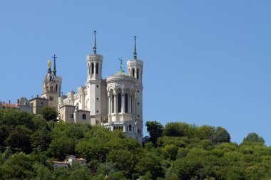 Lyon Cathedral in the big blue sky clipart