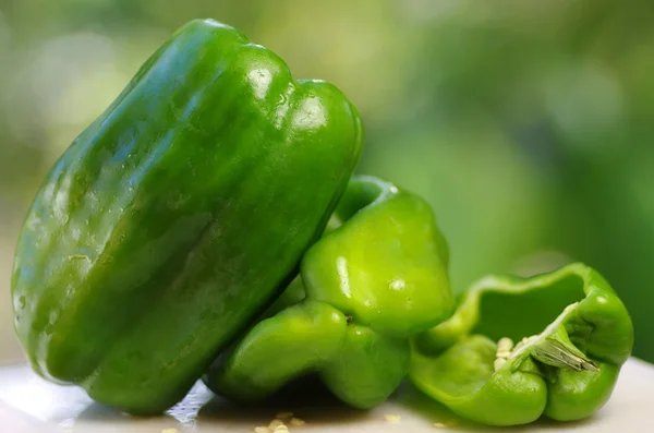 Green peppers on table — Stock Photo, Image